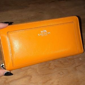 Orange Coach leather wallet